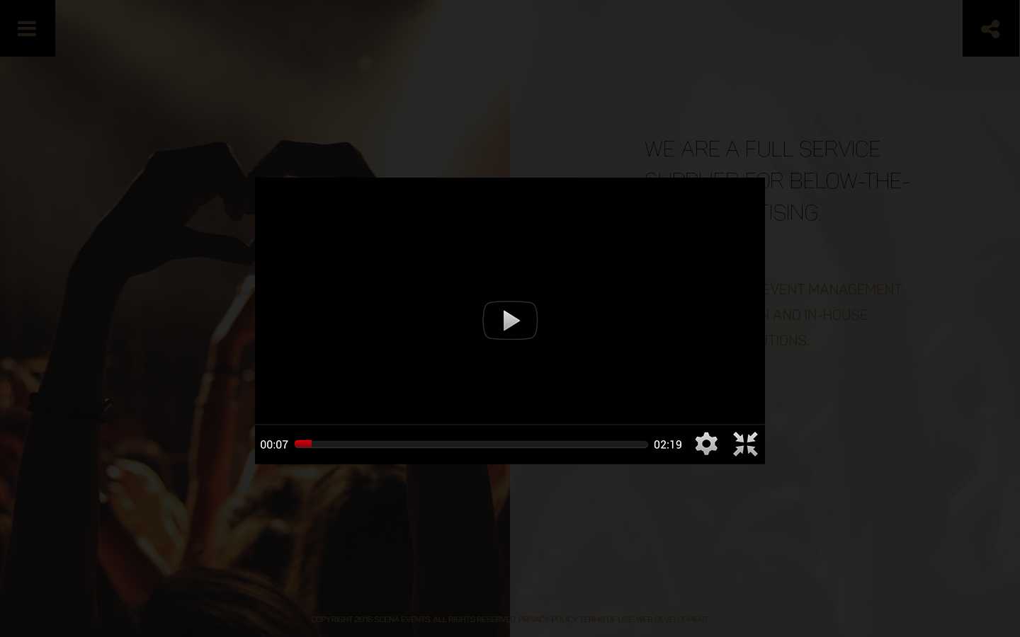 Scena homepage with the video lightbox open, showing the player controls over the dimmed page