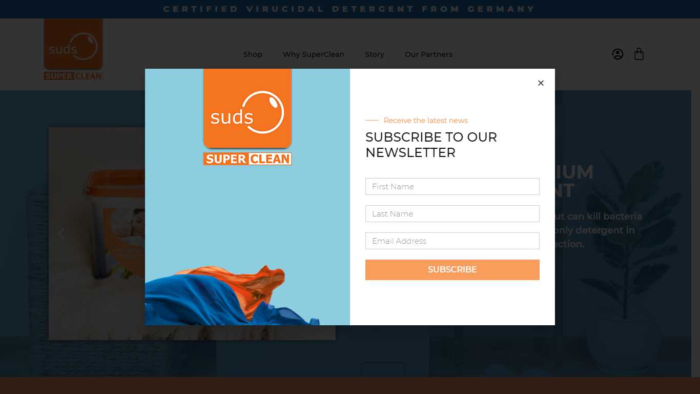 Suds SuperClean newsletter subscribe modal with first name, last name, and email fields over the dimmed homepage