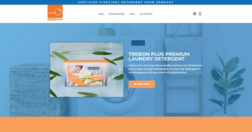 Suds SuperClean homepage hero with a Trebon Plus detergent tub beside the 'Trebon Plus Premium Laundry Detergent' heading and a Shop Now button over a blue background