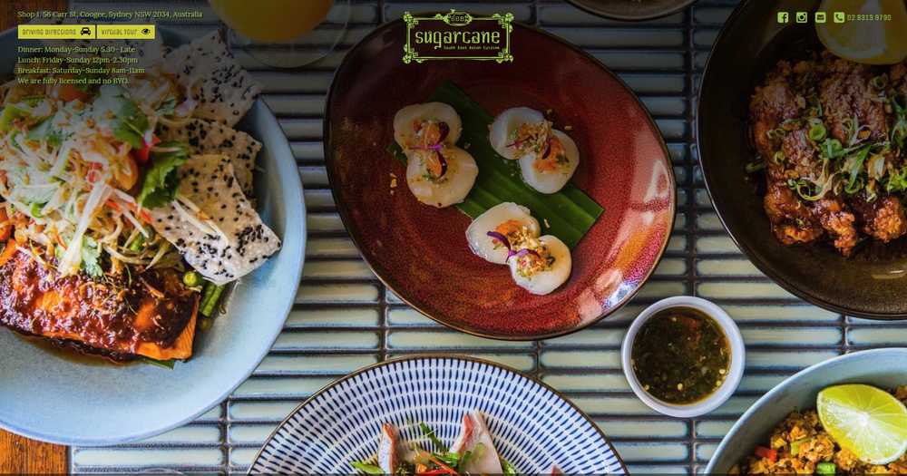 Sugarcane Restaurant homepage with an overhead spread of whole fish salad, scallops on betel leaf, and sticky pork ribs, beside the Coogee address, opening hours, and phone number